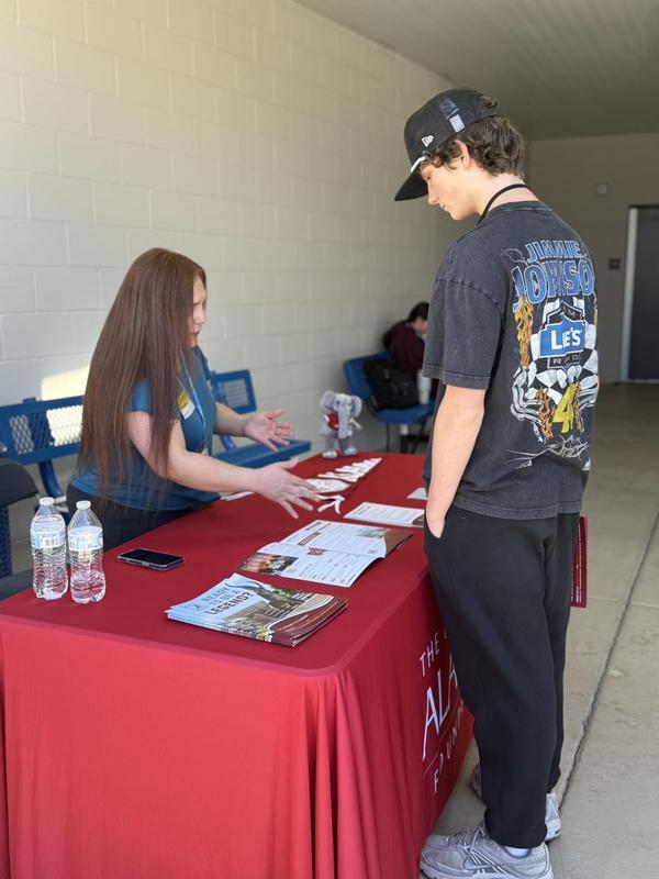 photo of student talking to college rep