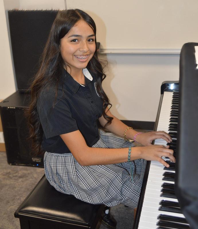 Student playing piano