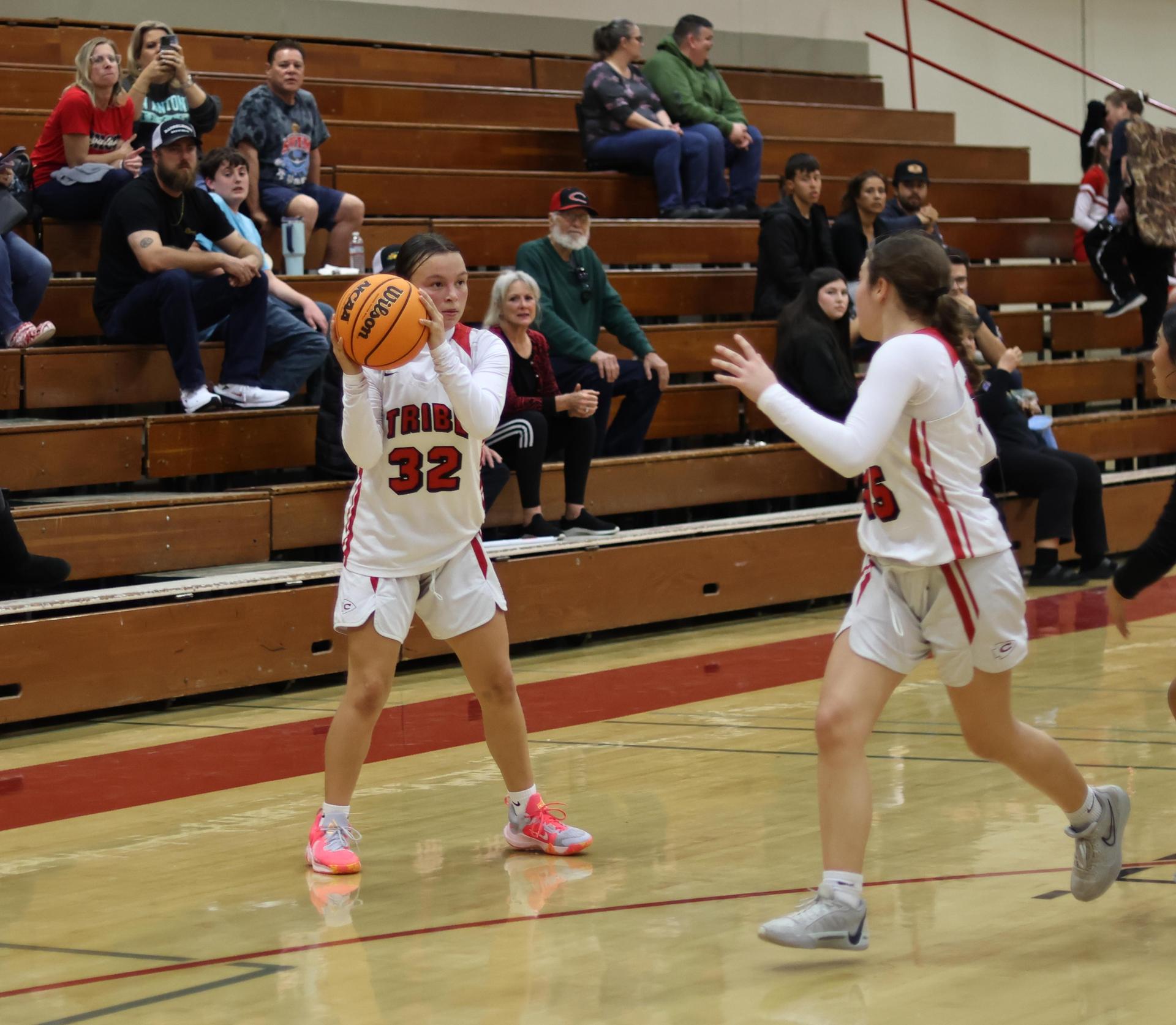 junior varsity girls playing basketball against parlier