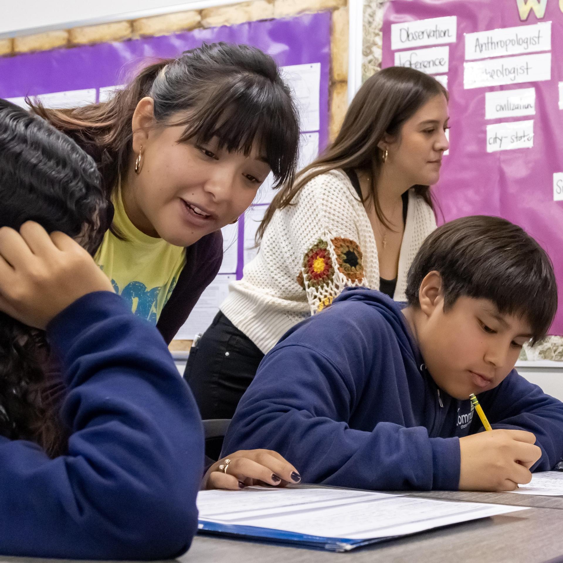 Gaby works with a few students
