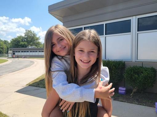 Students outside, in front of the school in August 2025.