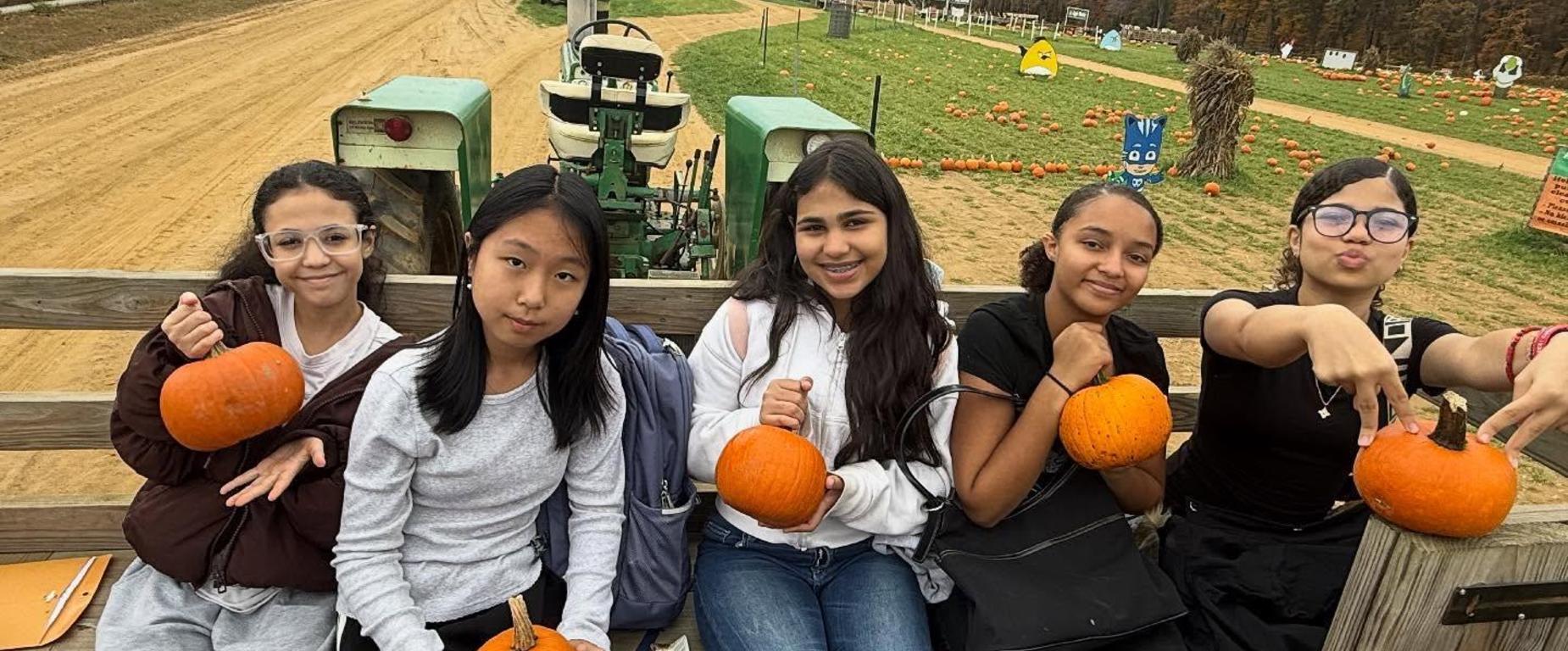 students with pumpkins