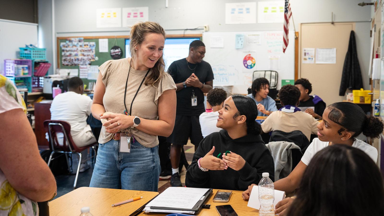 Teacher and students interacting in classroom