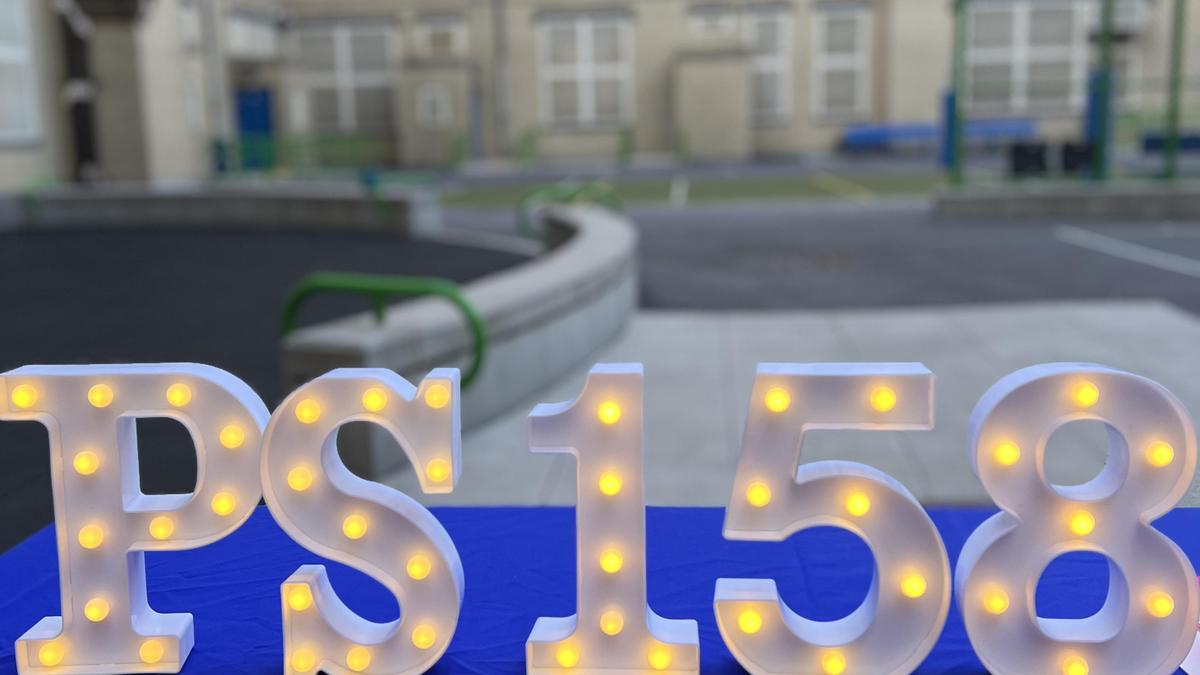 PS 158 sign in lights