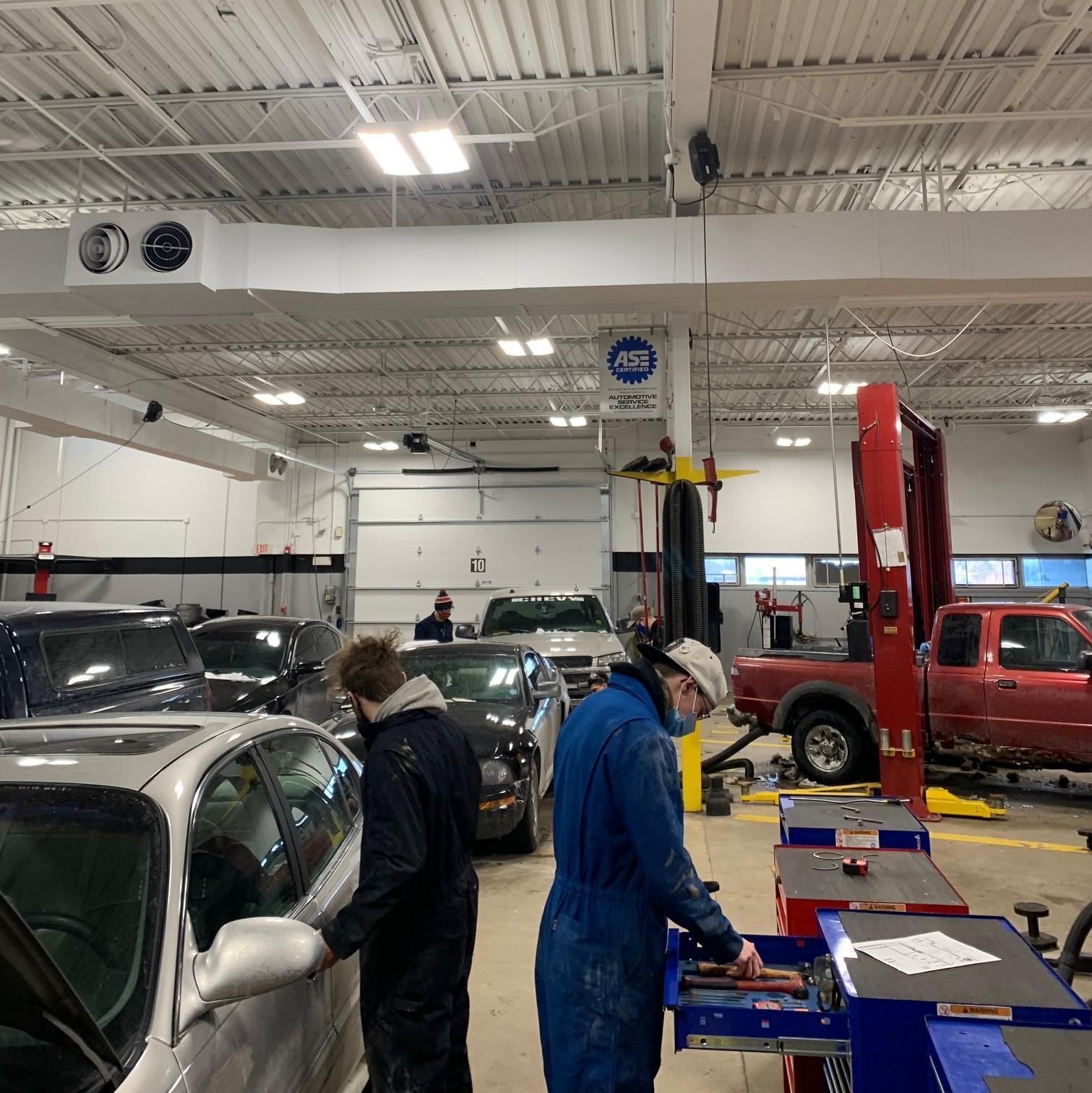 Auto students working in the auto shop