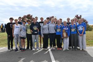 Boys and Girls cross country teams with medals and trophy