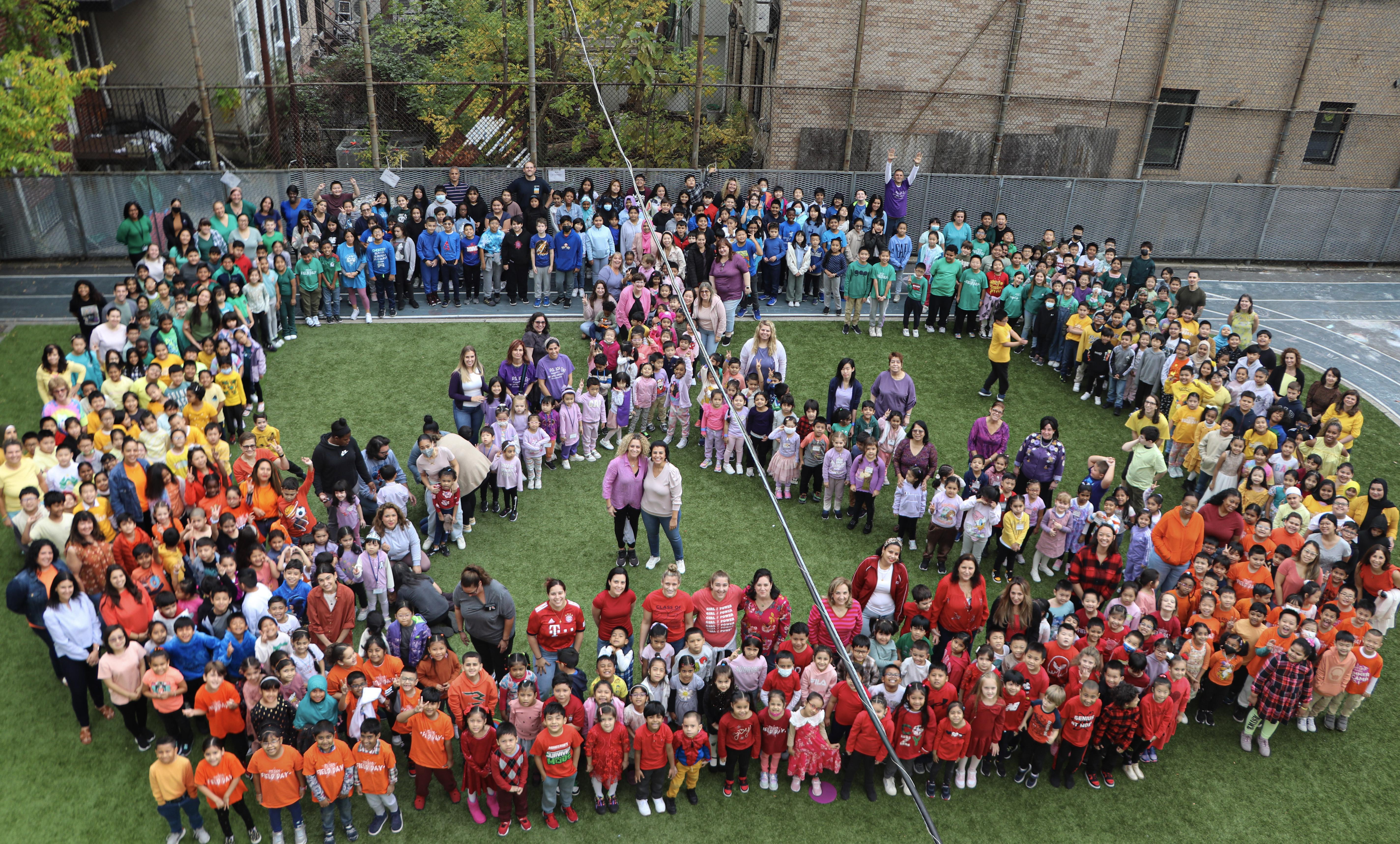 Image of students making a peace sign