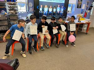 3B boys wobble to show how sound waves move through the air.