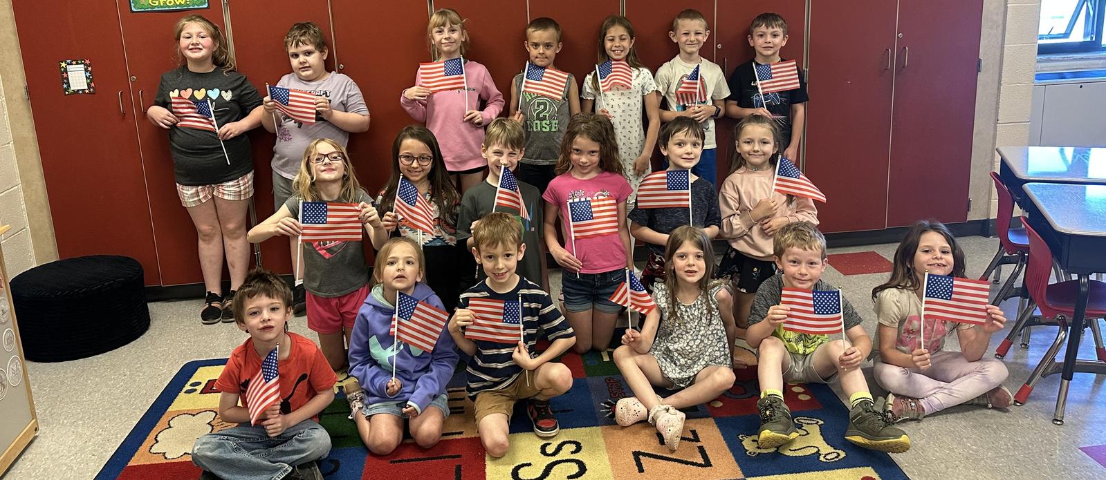 Students with small america flags