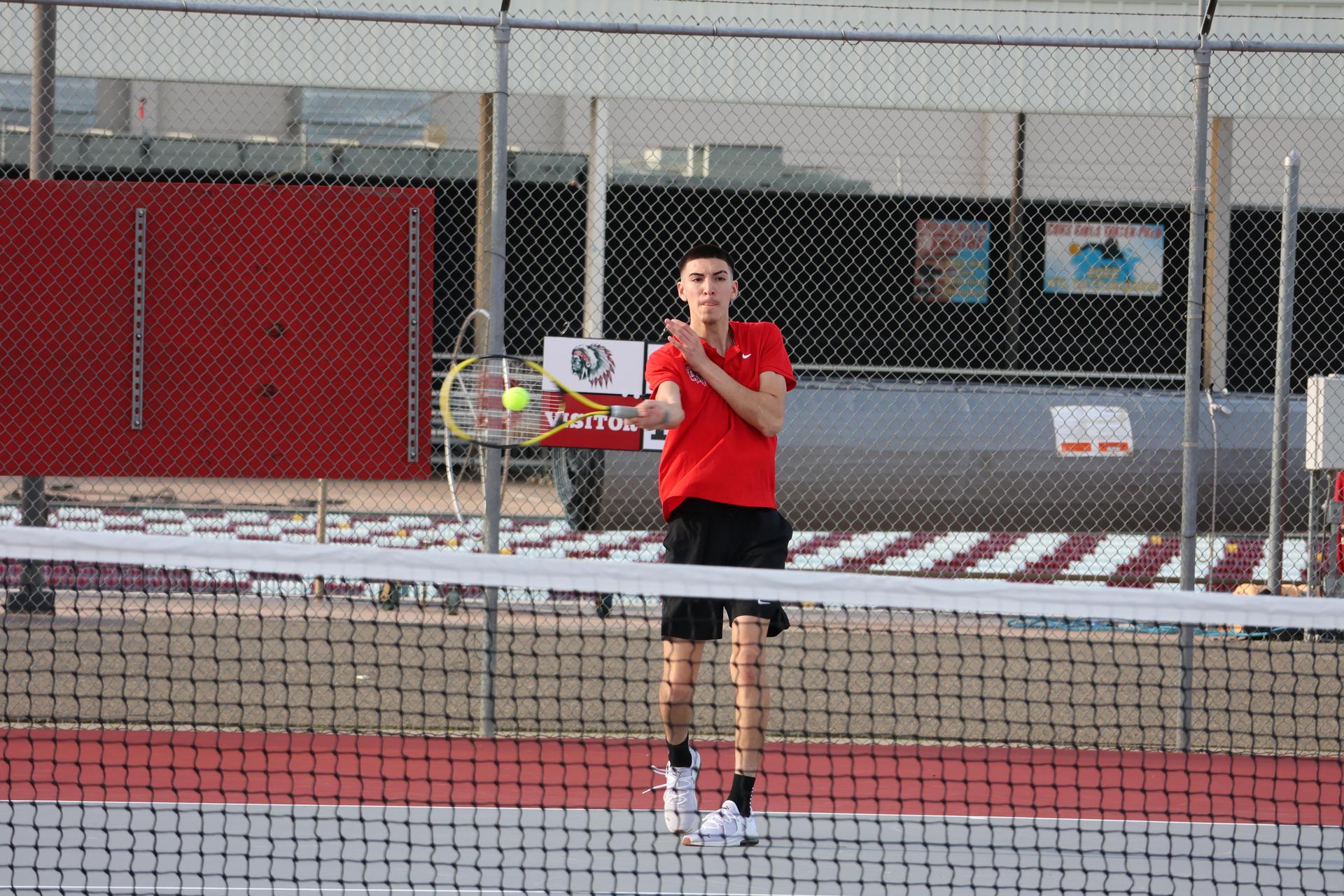 CUHS Boys playing tennis against coalinga