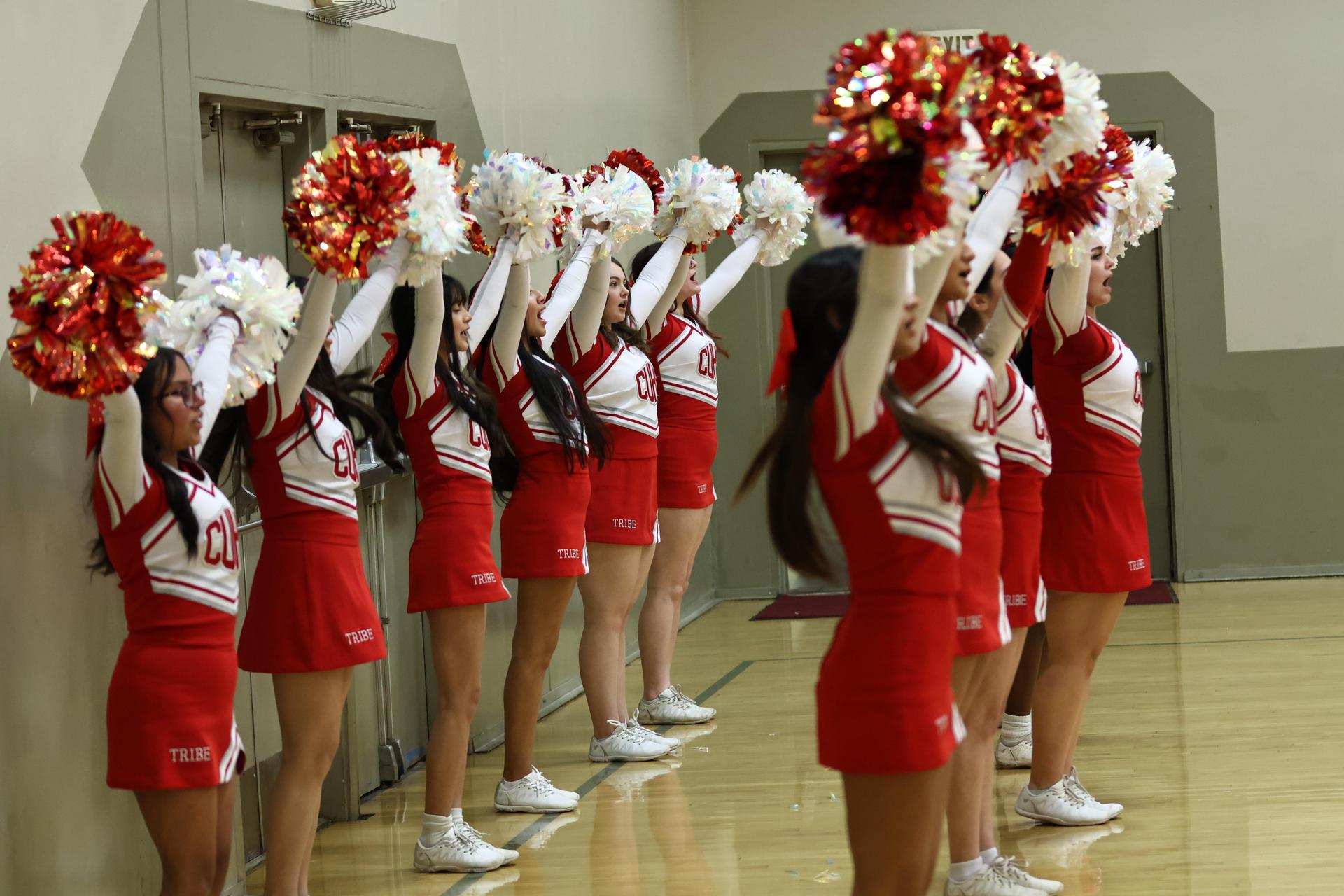 Varsity boys playing basketball against yosemite
