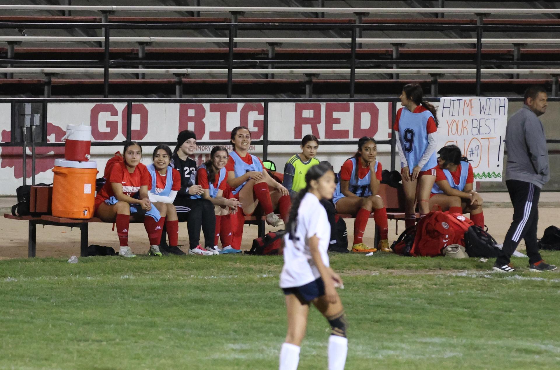 Varsity girls playing soccer against sunnyside