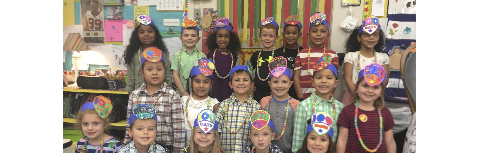 school children wearing hats celebrating one hundred days of school