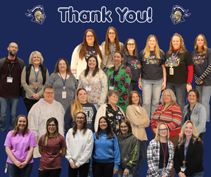 large group of paraprofessionals and aides with thank you above them