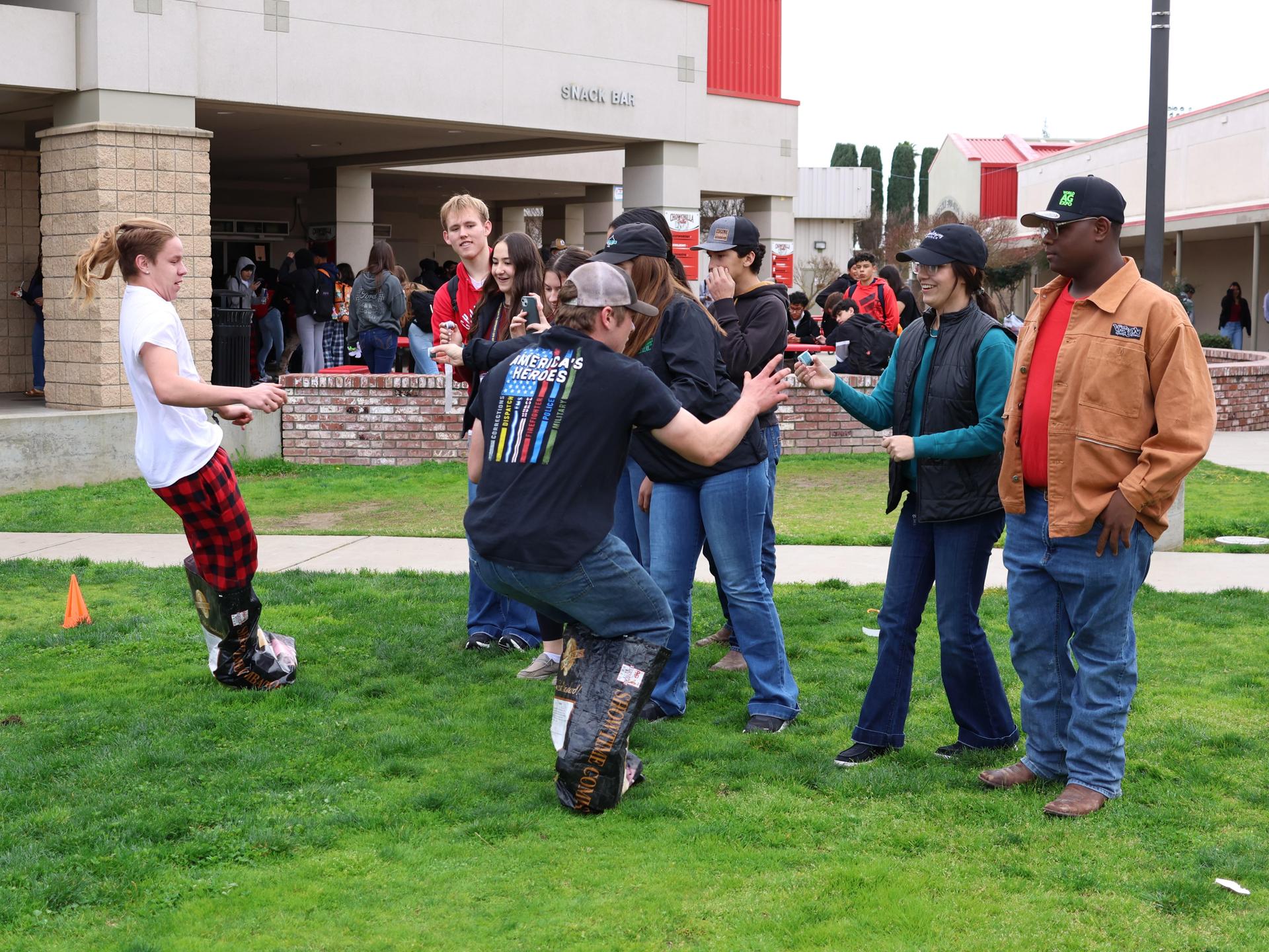 students and staff enjoying the feed bag relay