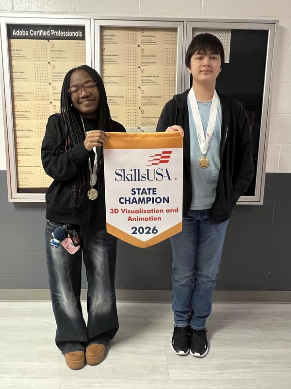 Smiling students with awards