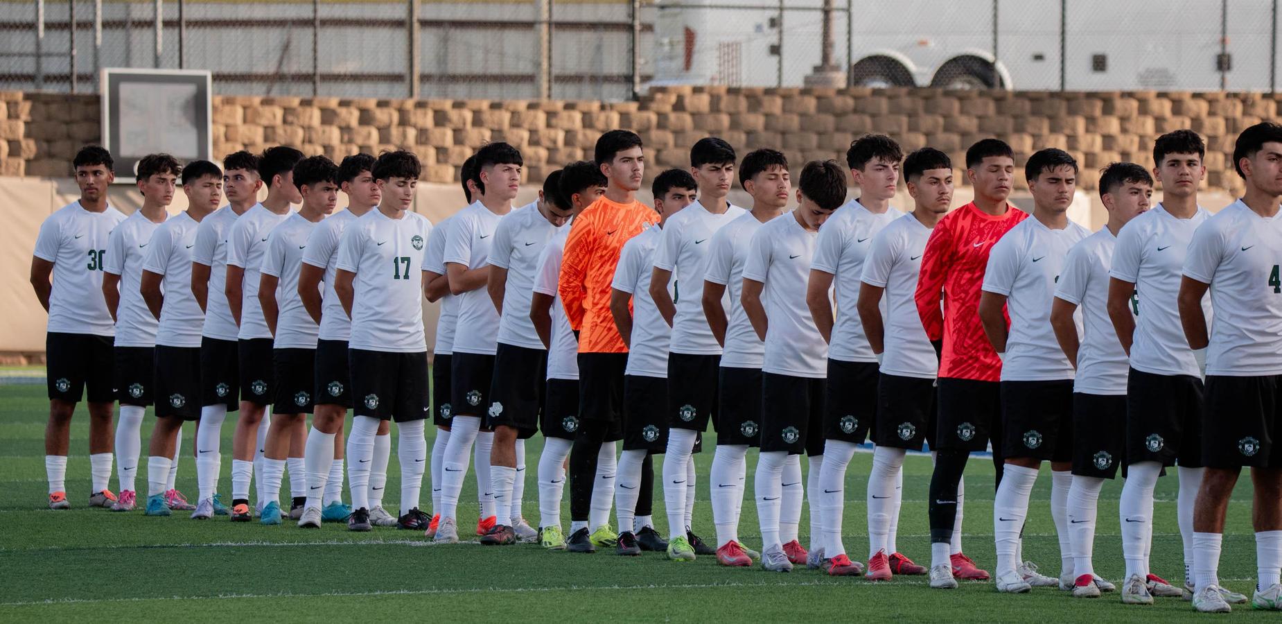 boys soccer standing in line