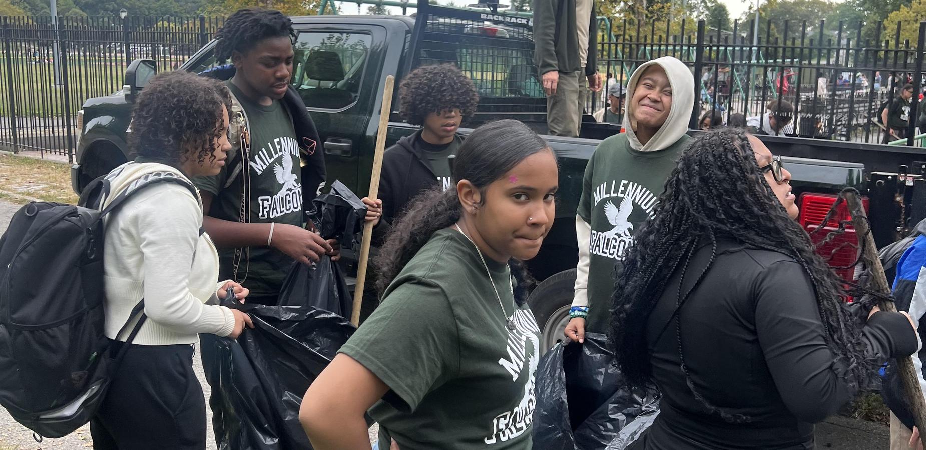Students cleaning up Pelham Bay Park for community service day.