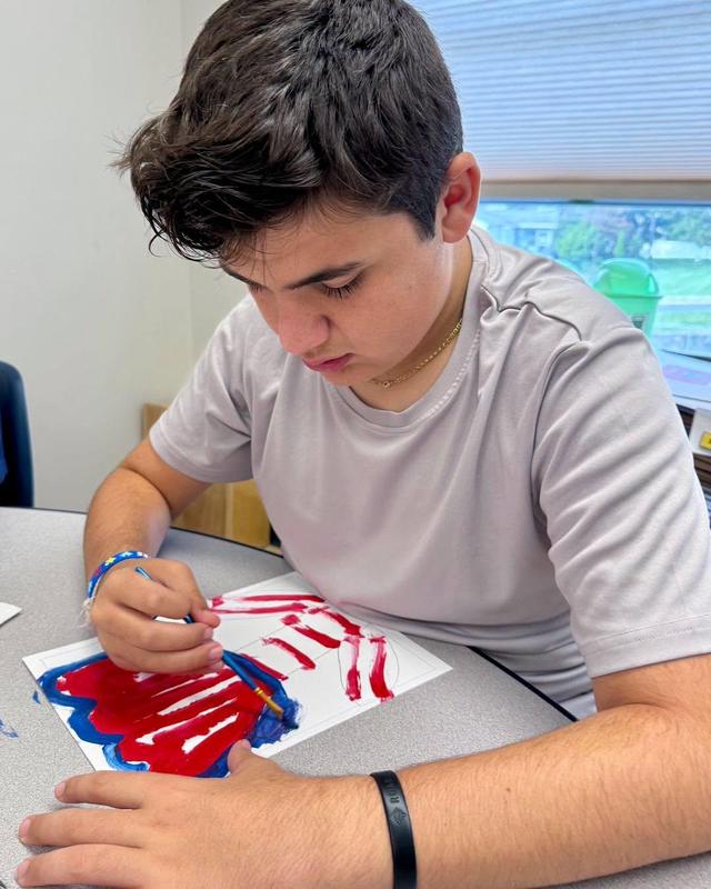 Student doing artwork