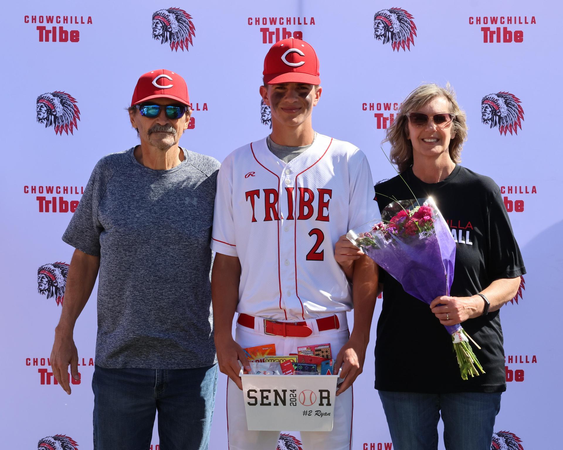 Seniors Posing With Teammates, Coaches, And Family