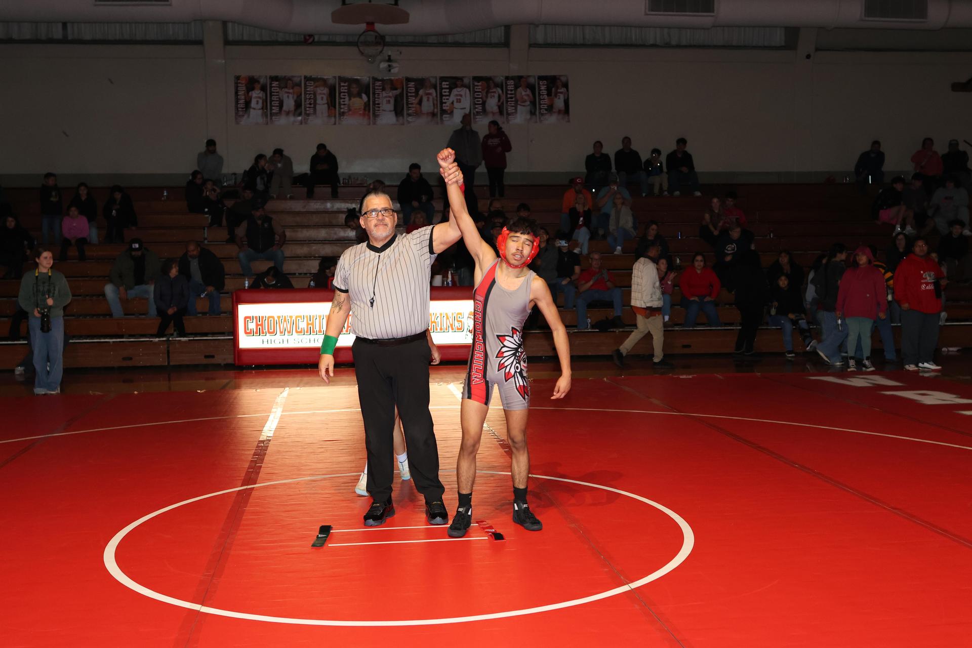 Wrestling winners with hands up 137