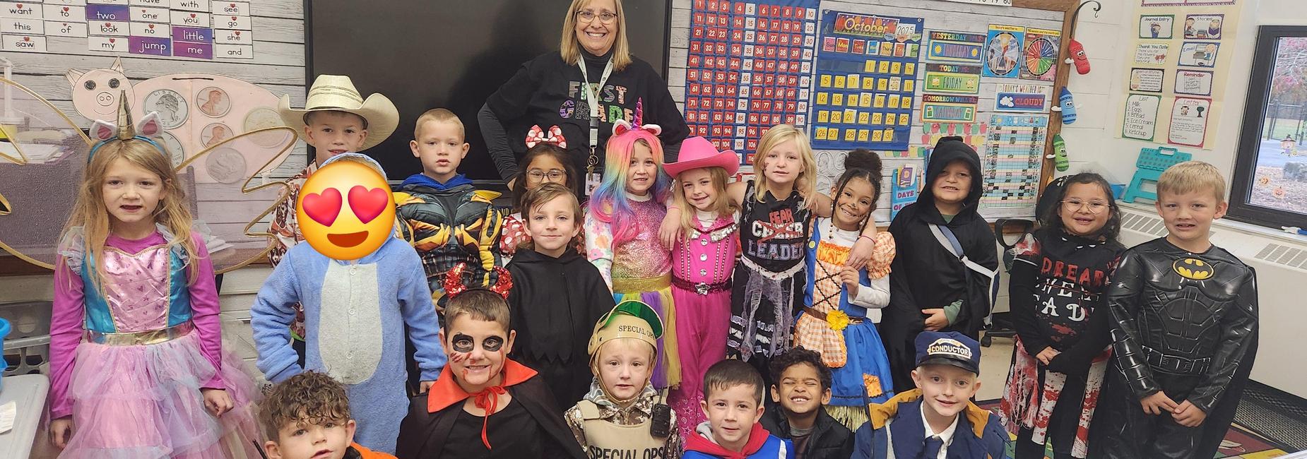 Mrs. Collier's first graders in their Halloween costumes are ready for CES Swoop the Loop trick or treating