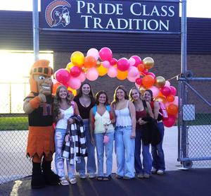 The TK Mascot welcomes seniors as they enter the stadium.