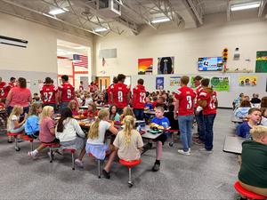 Football players and elementary lunch