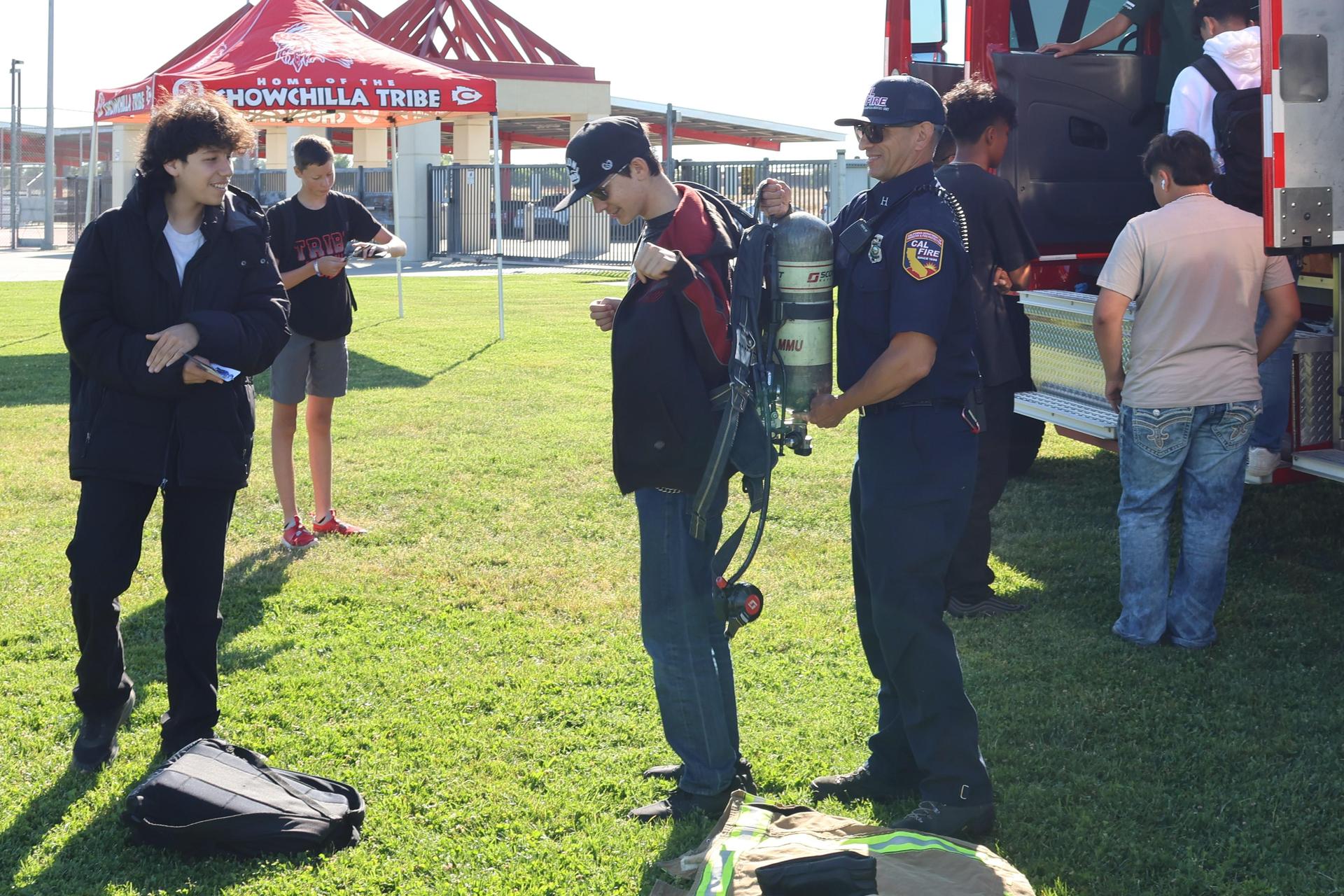 Firefighters speaking to students