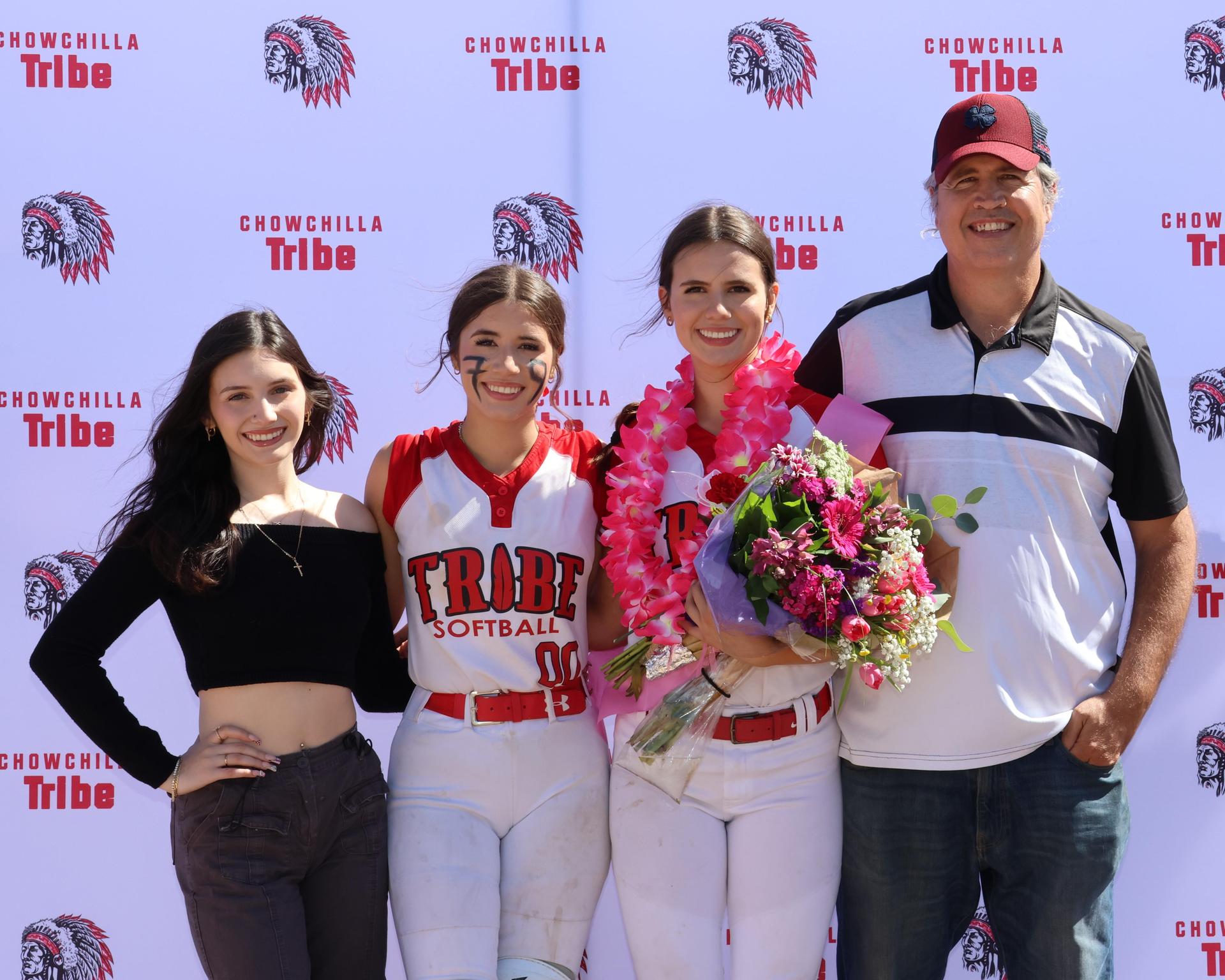 Seniors Posing With Teammates, Coaches, And Family