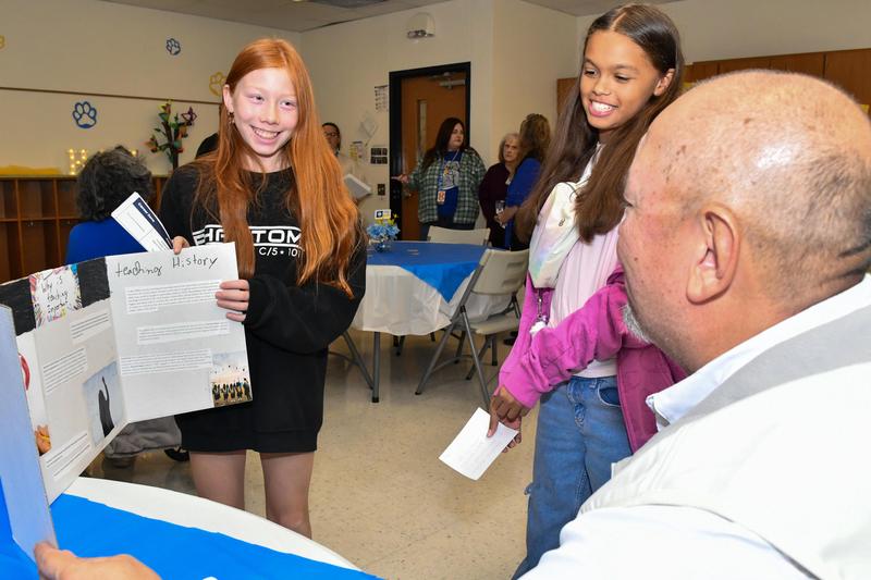 Student Presenting to an adult