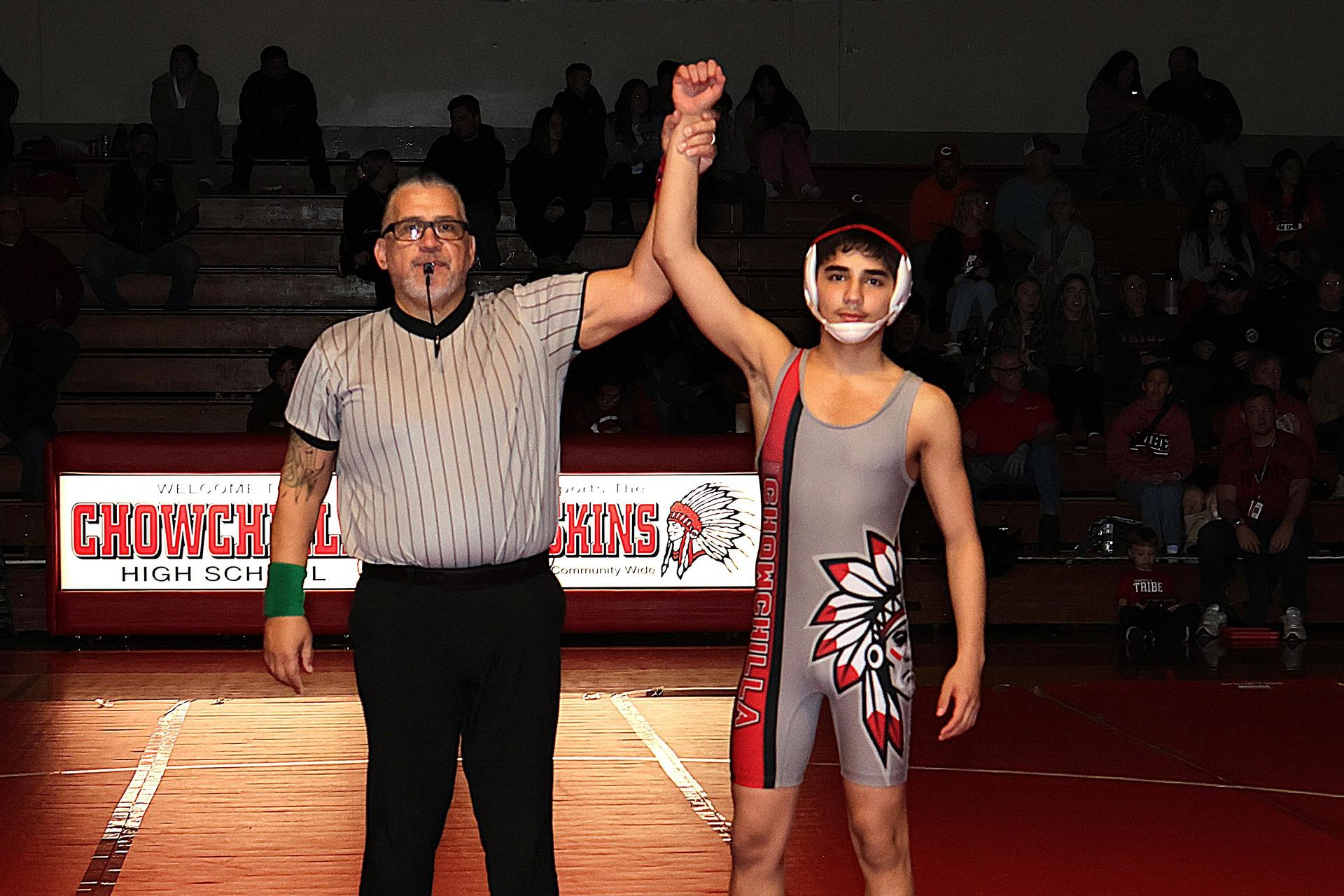 Wrestling winners with hands up 27
