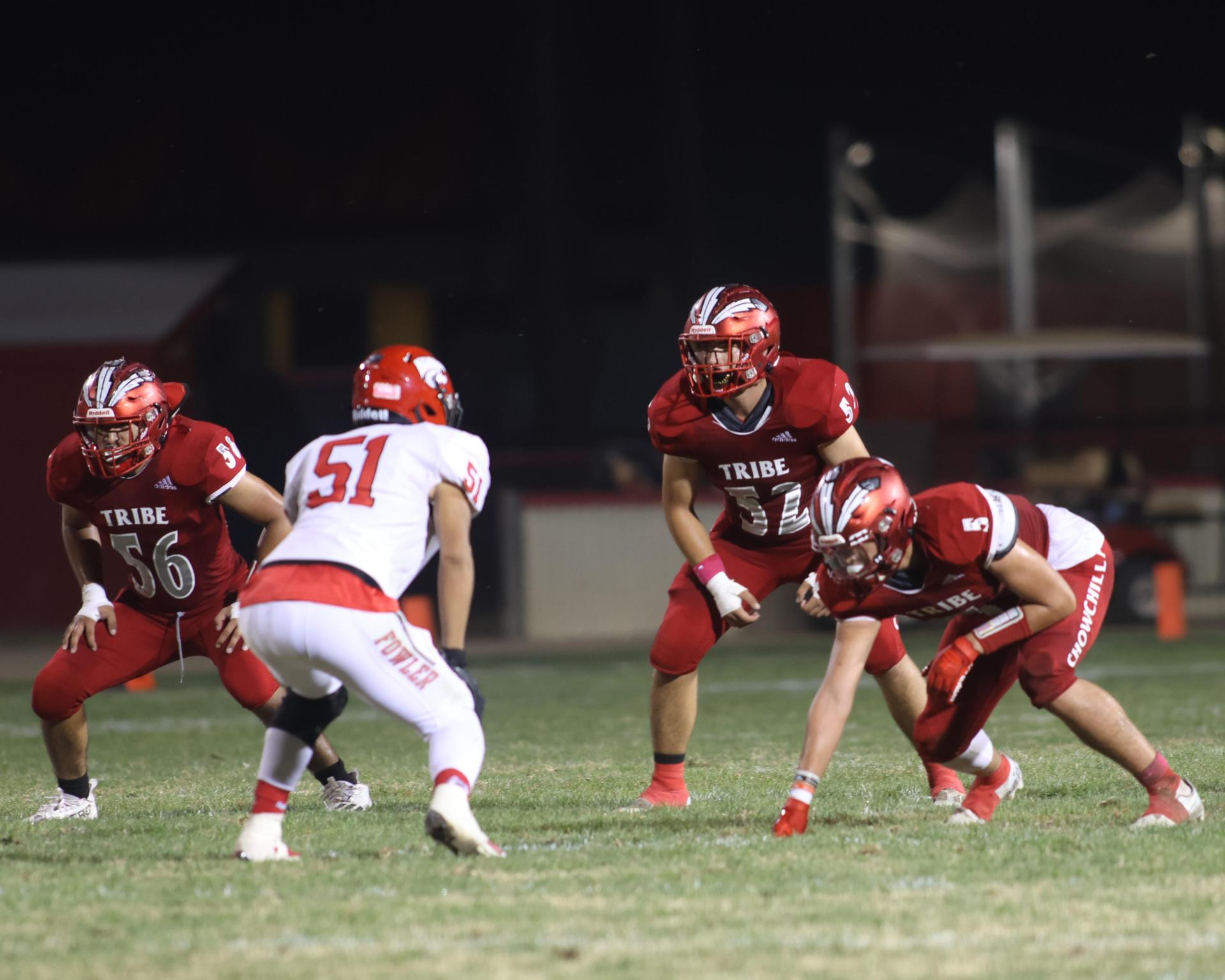 varsity boys playing football against Fowler