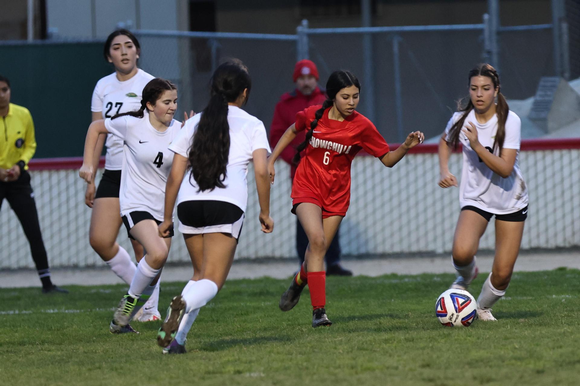 Junior varsity girls playing soccer against liberty