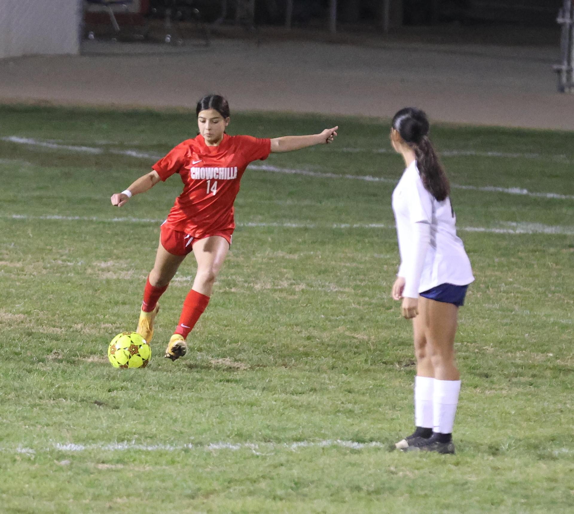 Varsity girls playing soccer against sunnyside