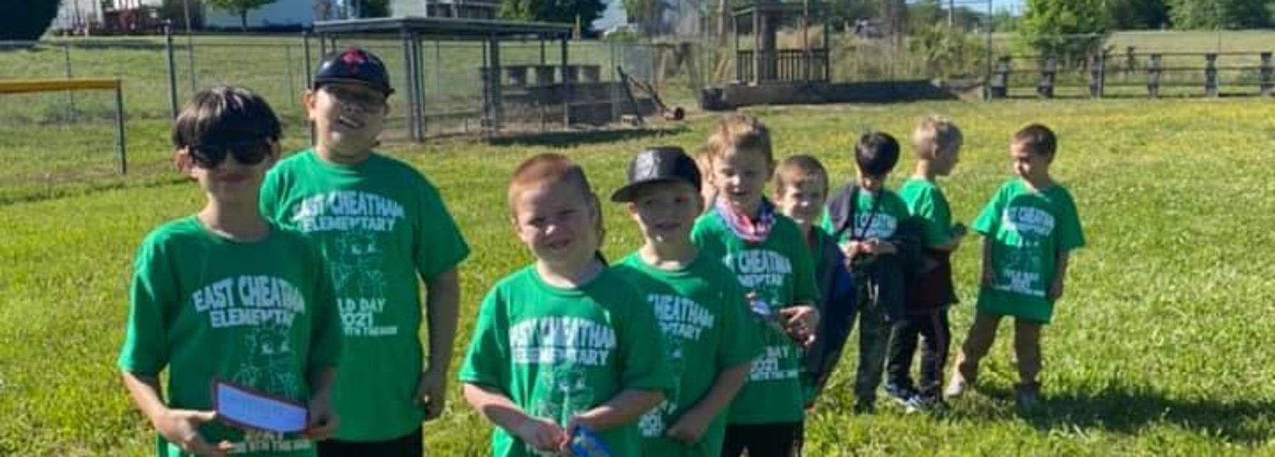 4th graders leading kindergarten on field day