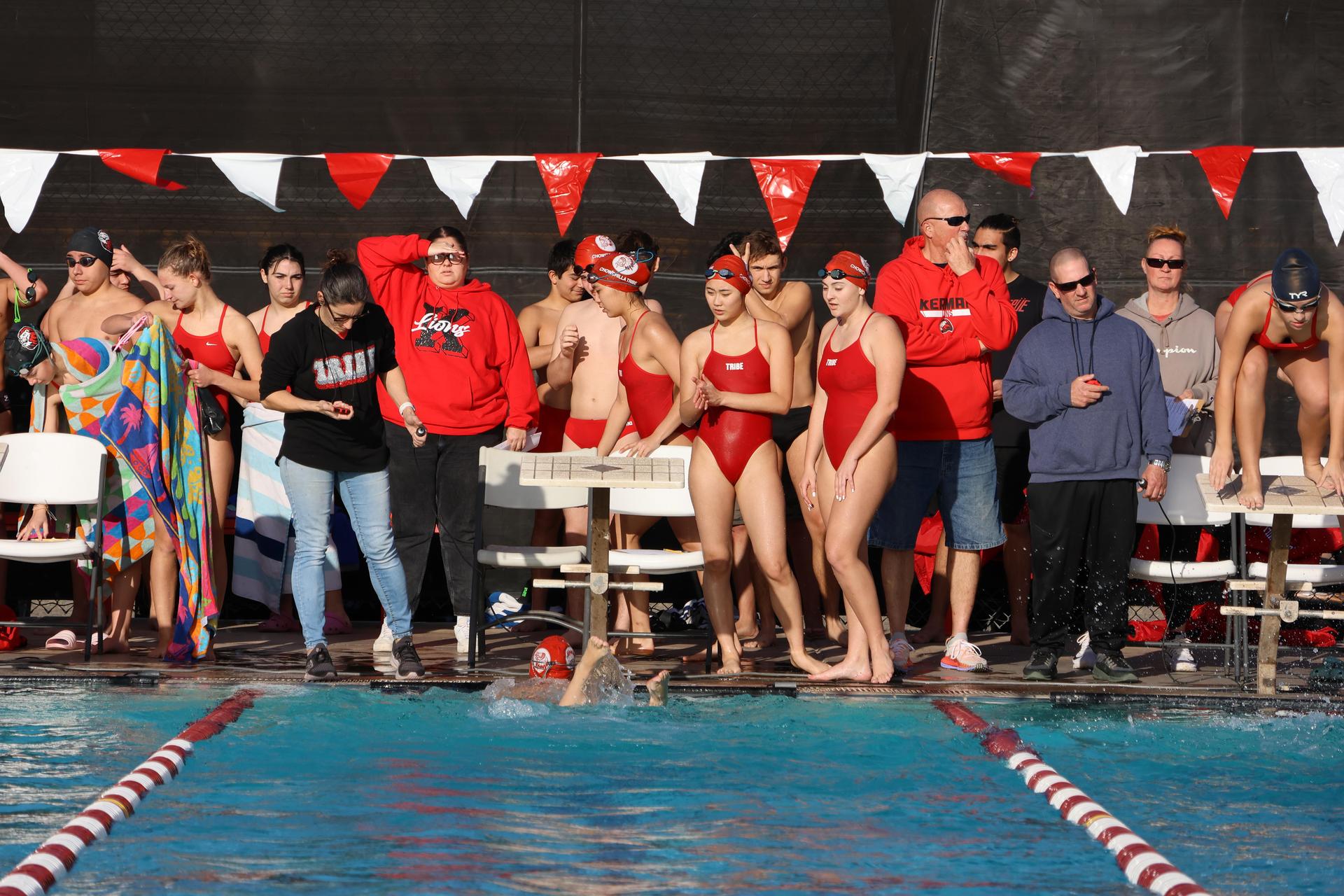 relay swimmers watching their team mates