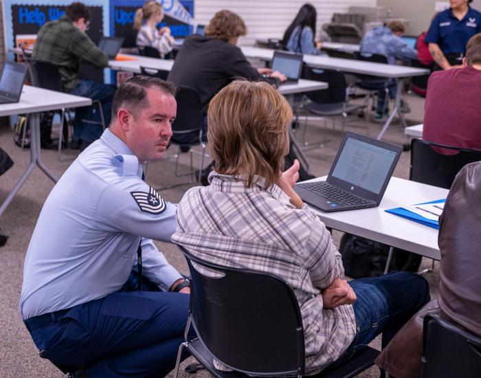 teacher instructing student