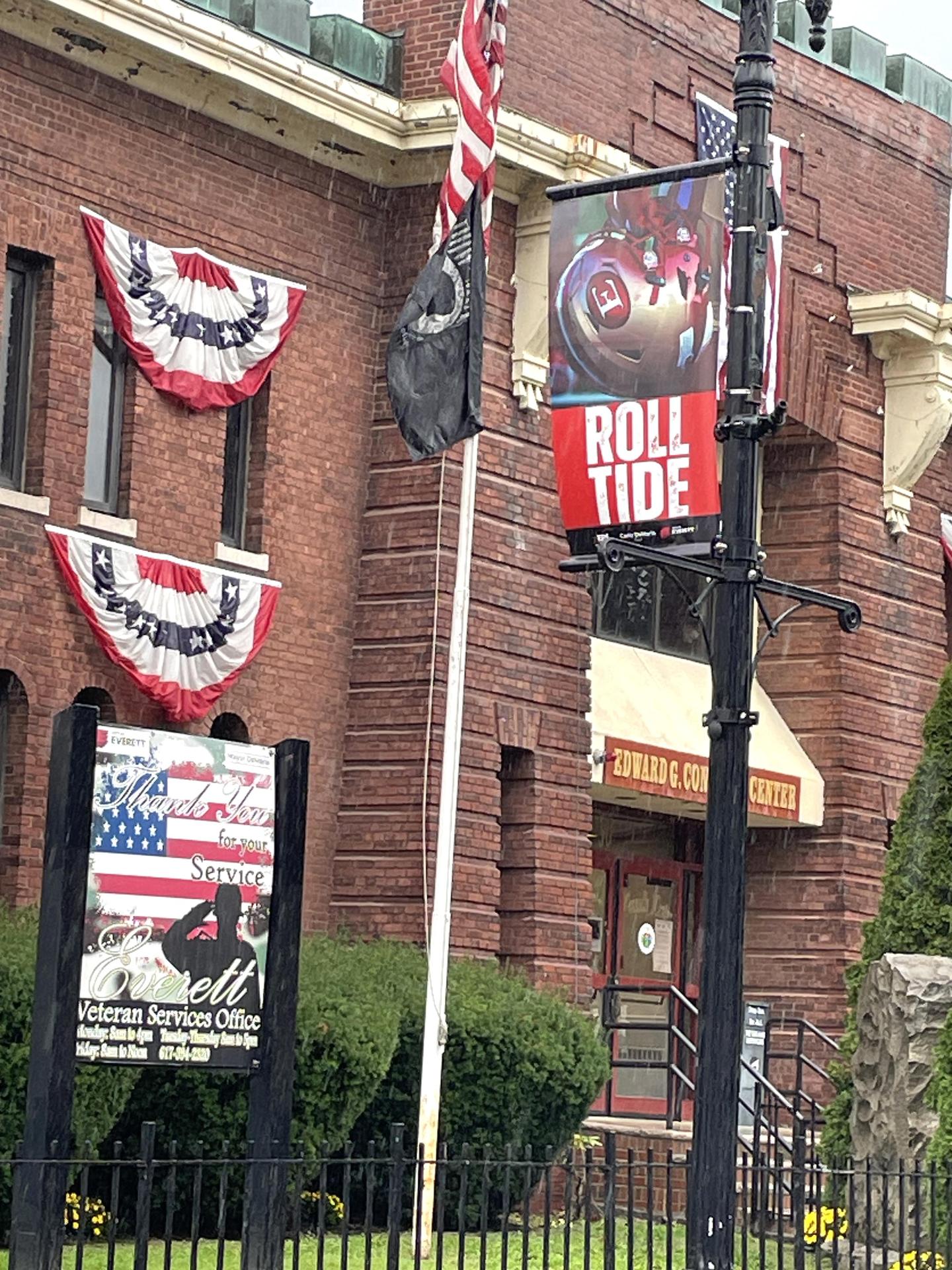 A sign on a pole on a street