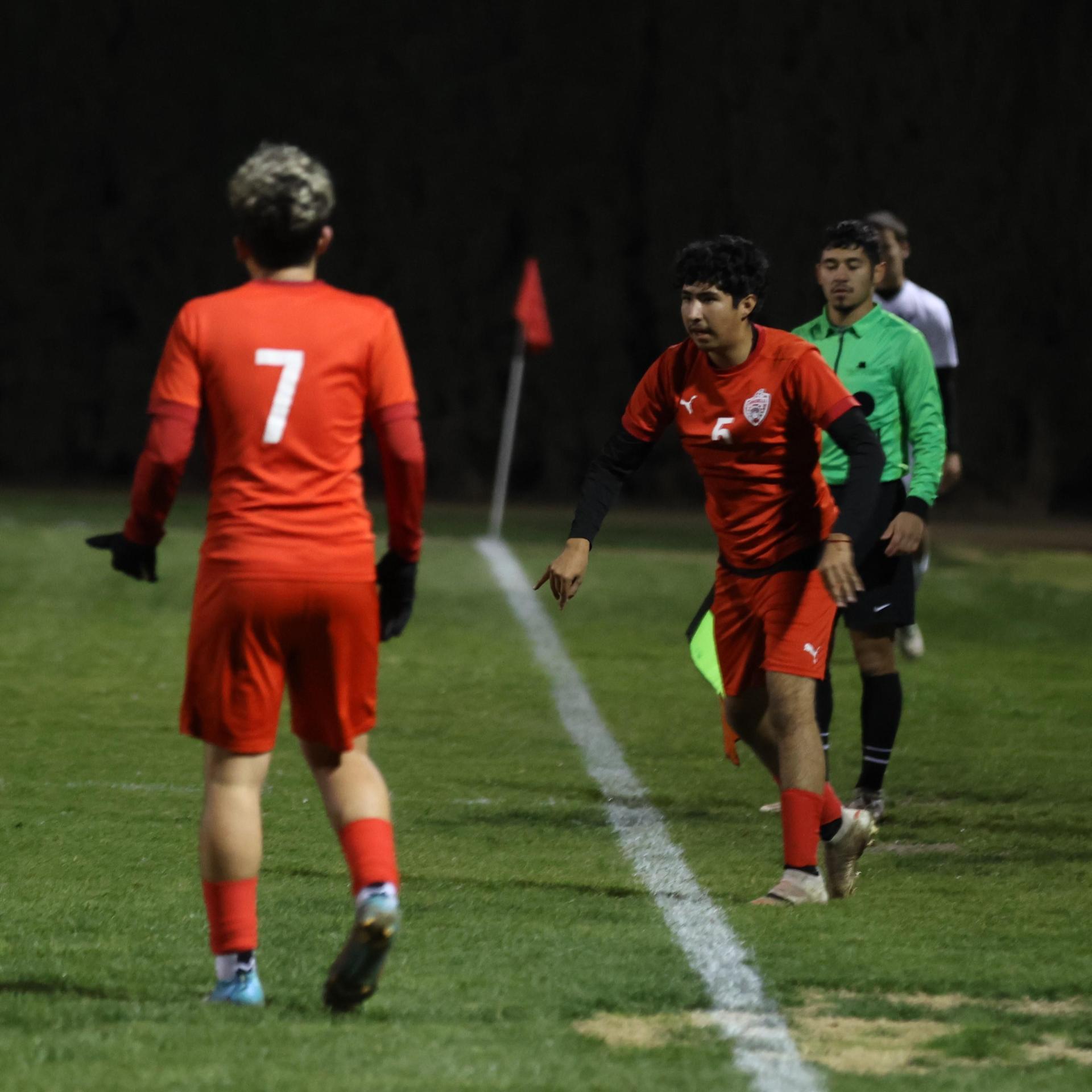 varisty boys soccer playing against yosemite
