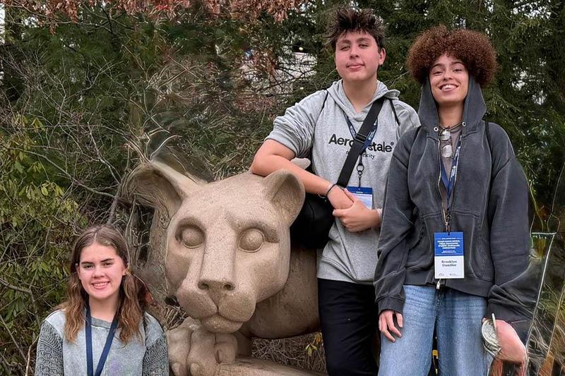 The 3 award-winning students pose on Penn-State lion shrine