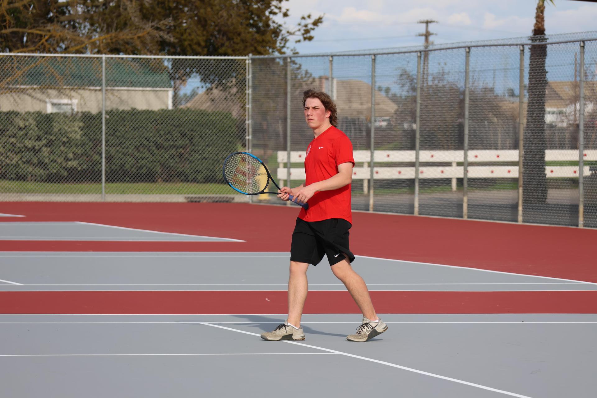 CUHS Boys playing tennis against coalinga