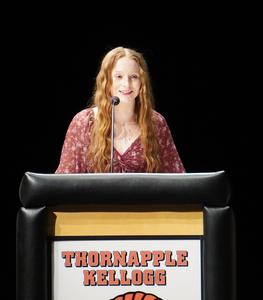 President of the TKHS NHS society speaks at the ceremony.