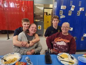 Two staff members with their children who are FFA members. FFA members.