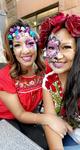 2 adults in traditional makeup