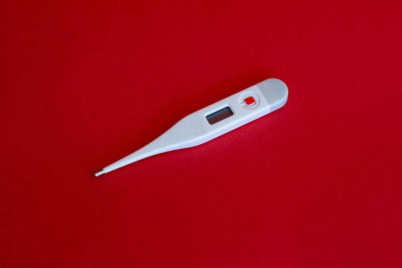 Thermometer for people on a red background