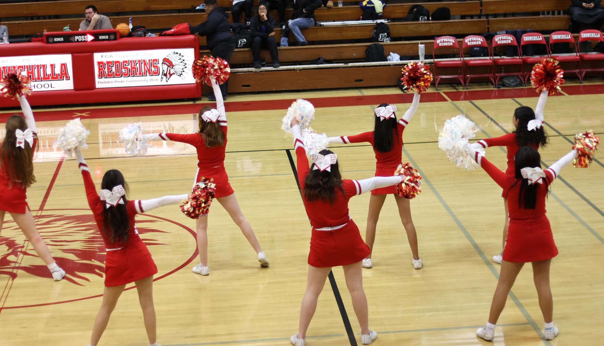junior varsity cheerleaders cheering