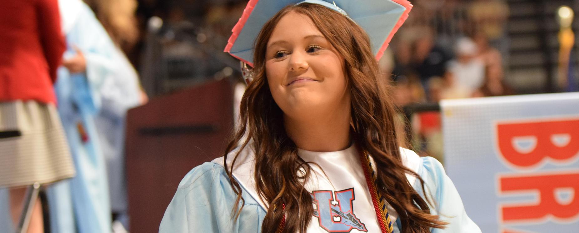 Female student in graduation cap and gown