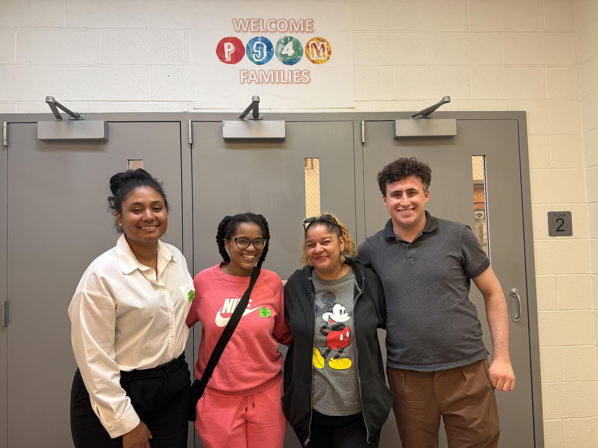 4 people standing in a line