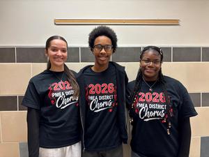 Image of 3 choral students wearing their show t-shirts